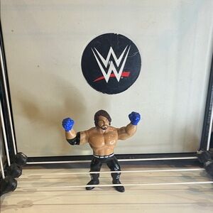 WWE Figure with Blue Gloves and Black Pants